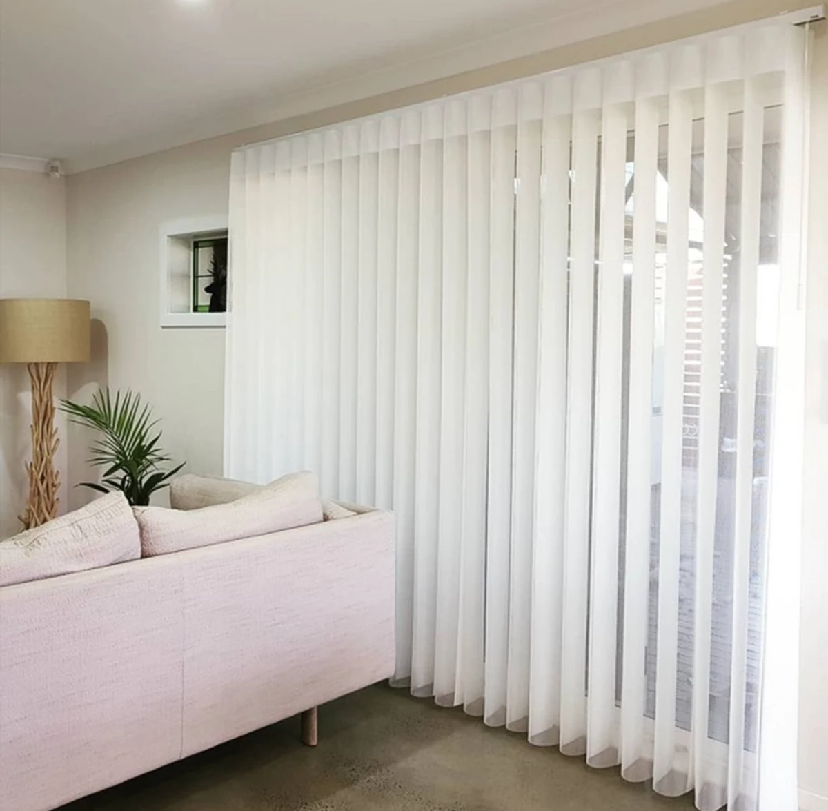 Sheer Elegant Shades fitted across sliding glass doors in a styled Brisbane living room