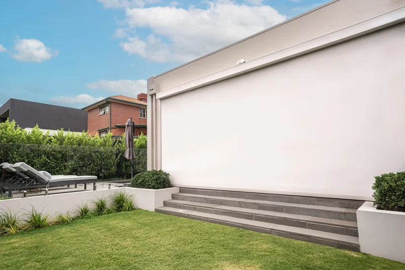 ZipScreen outdoor blinds enclosing a coastal alfresco entertaining area