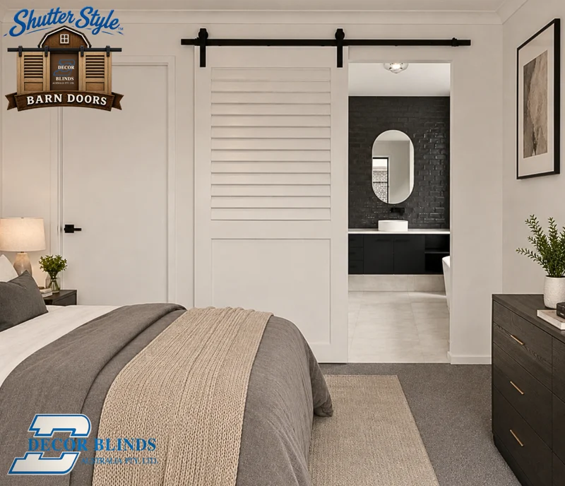 White louvred sliding barn door between a bedroom and ensuite