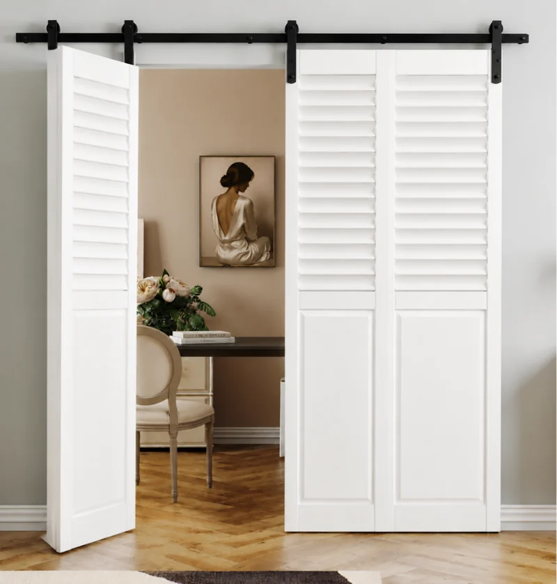 A louvred bi-fold barn door beside a study nook