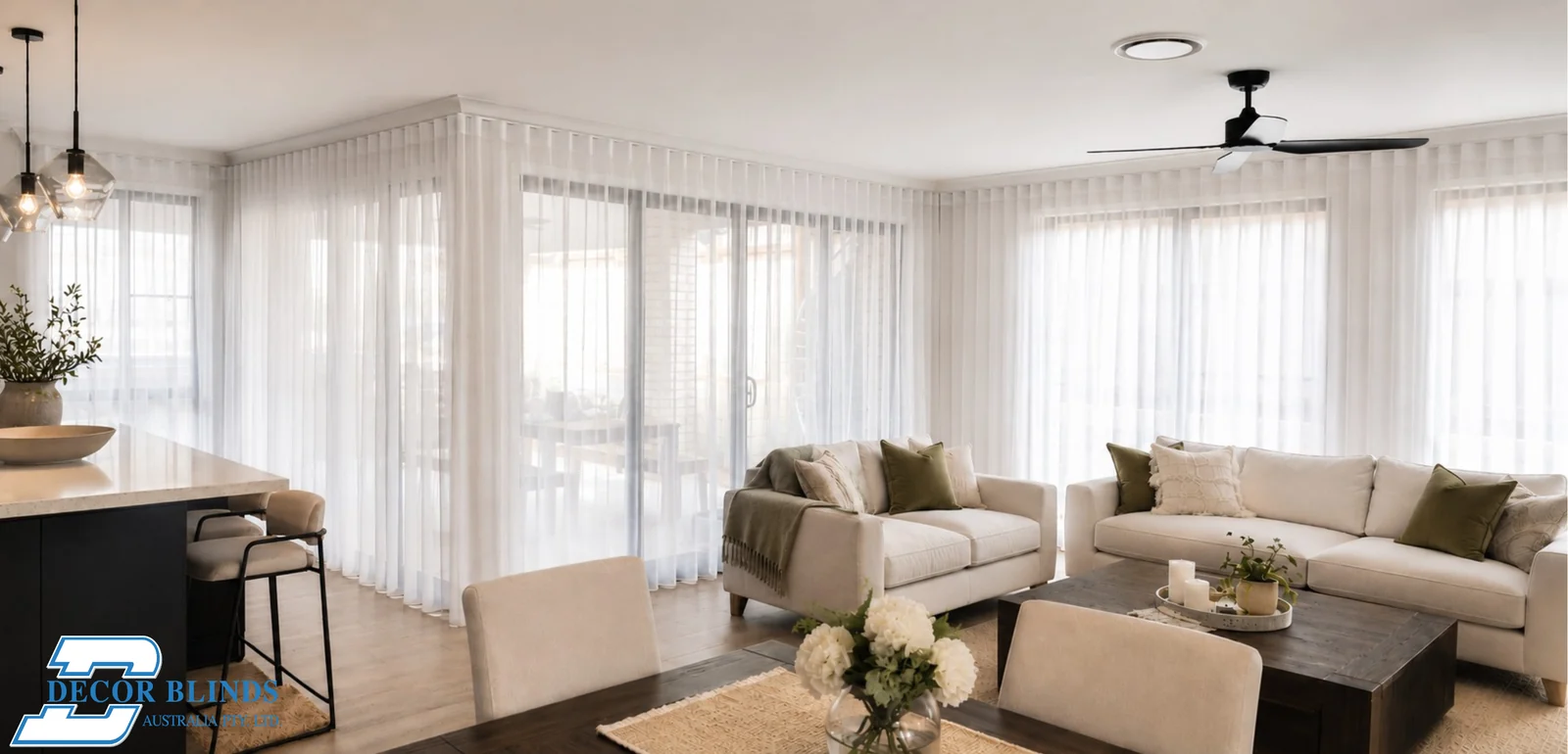 Sheer curtains around an open-plan living and dining room