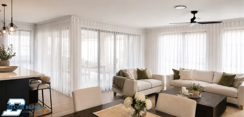 Sheer curtains across the full width of an open-plan kitchen and living area