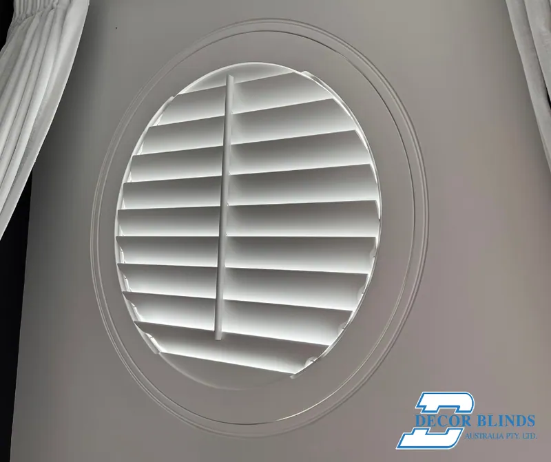 Circular plantation shutter fitted inside a round window