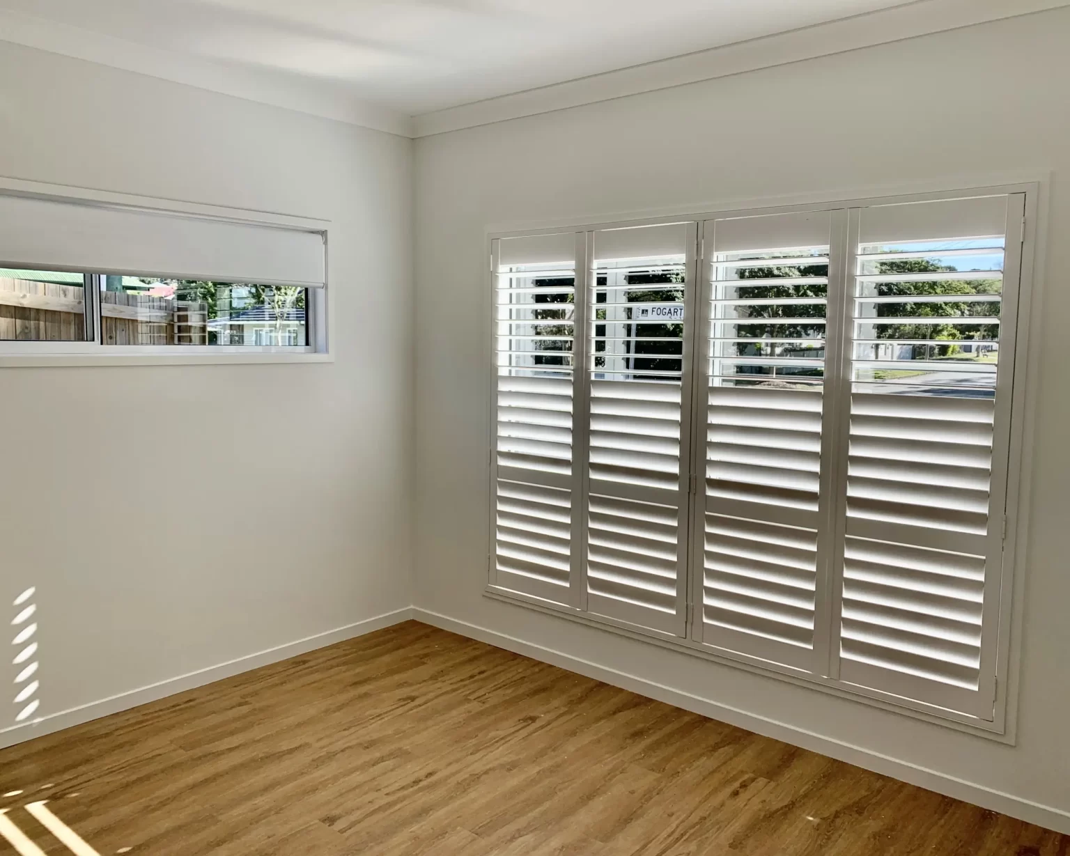Gold Coast home fitted with white Decor plantation shutters overlooking the water