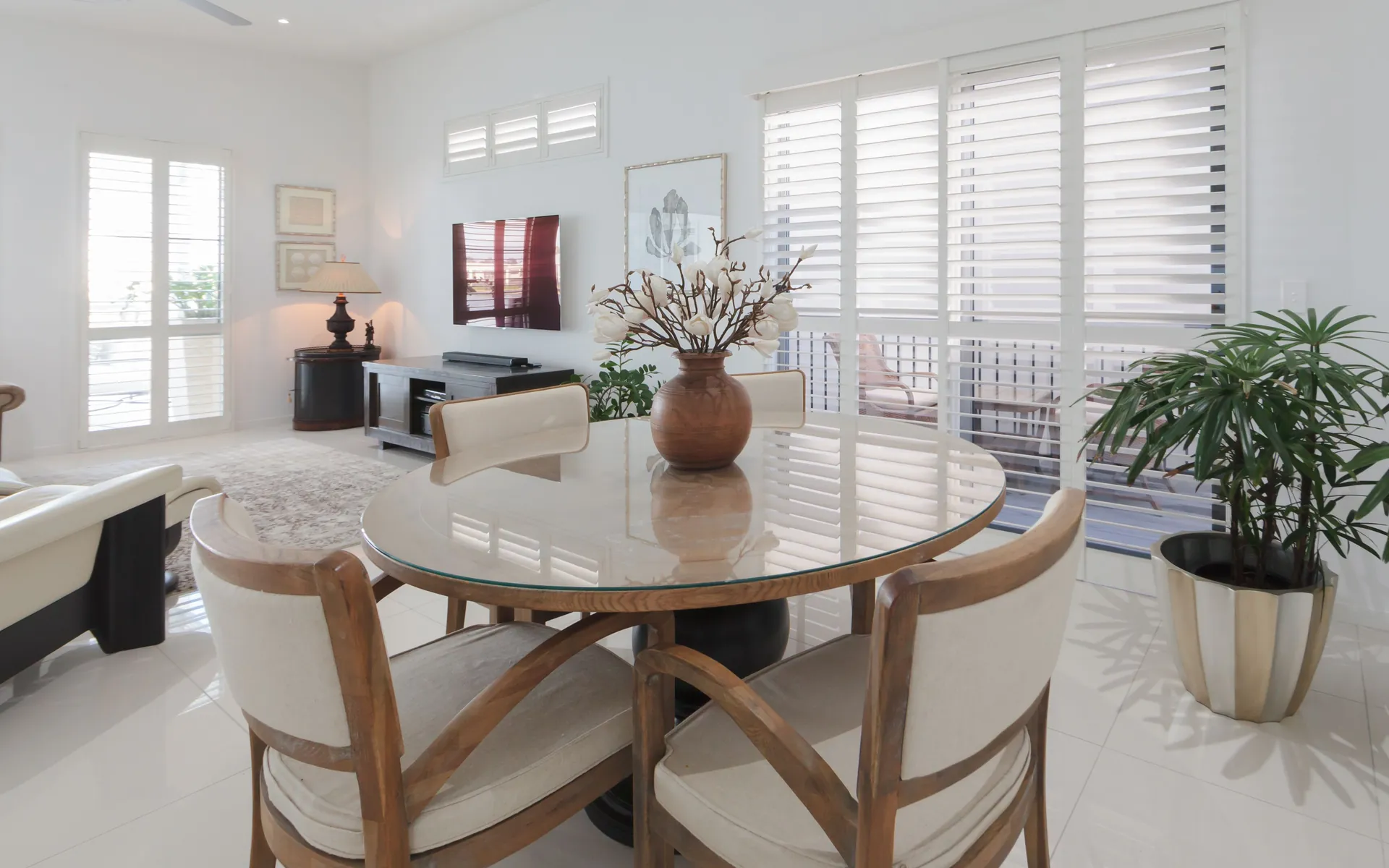 Bright Brisbane dining room fitted with white Thermalite plantation shutters