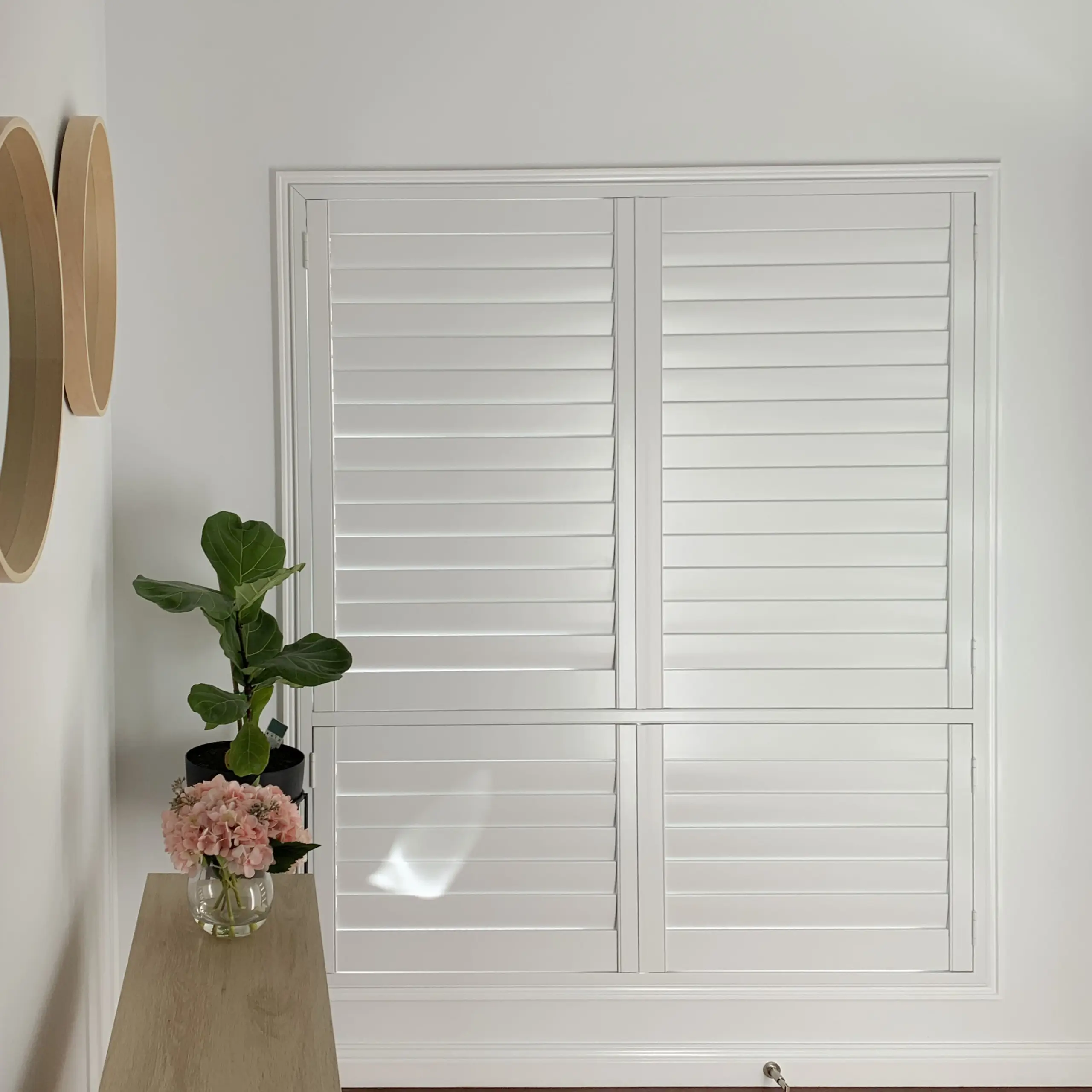 Close detail of white Thermalite plantation shutter louvres