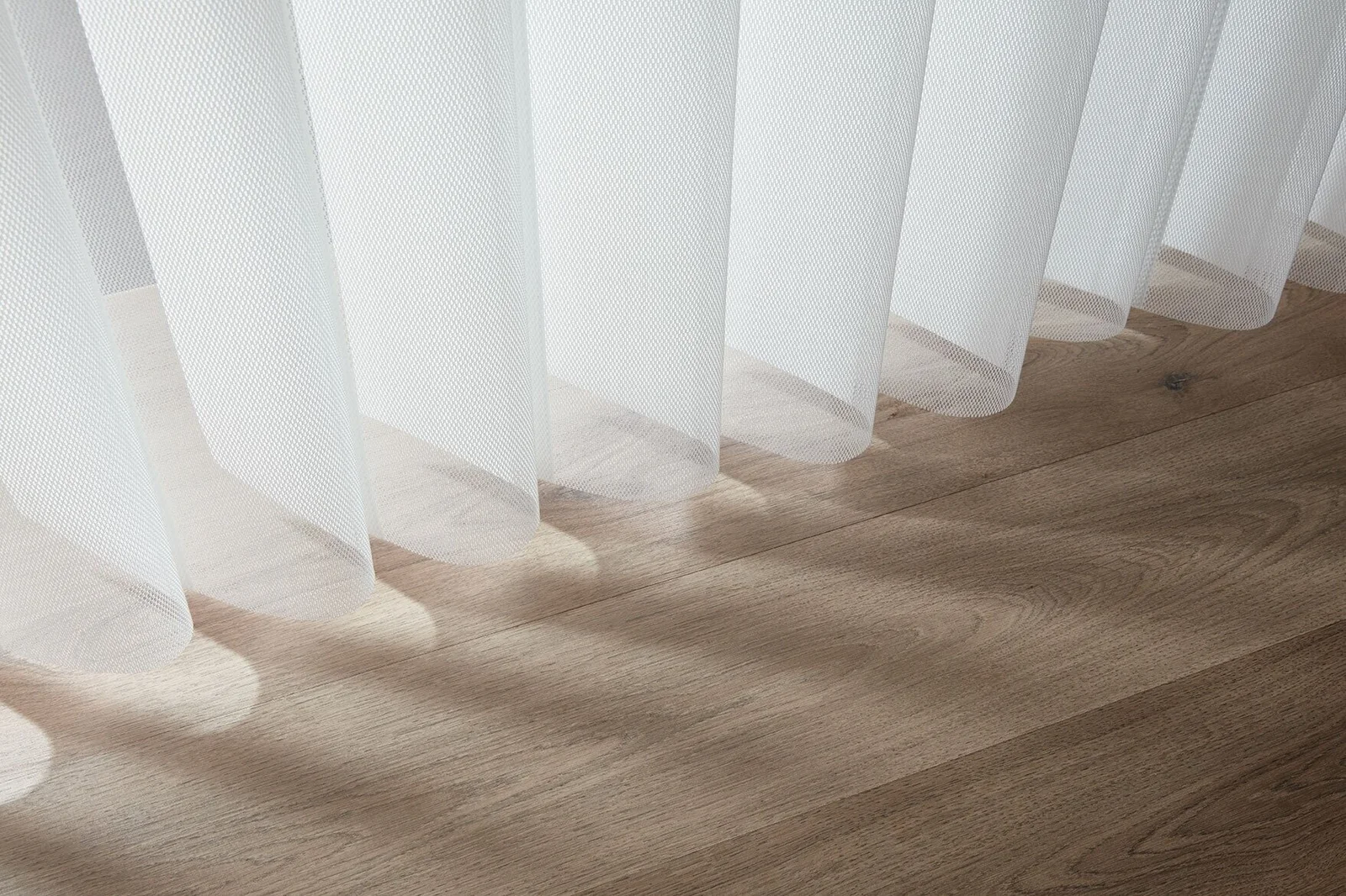 Close-up of individual Veri Shades fabric panels above a timber floor