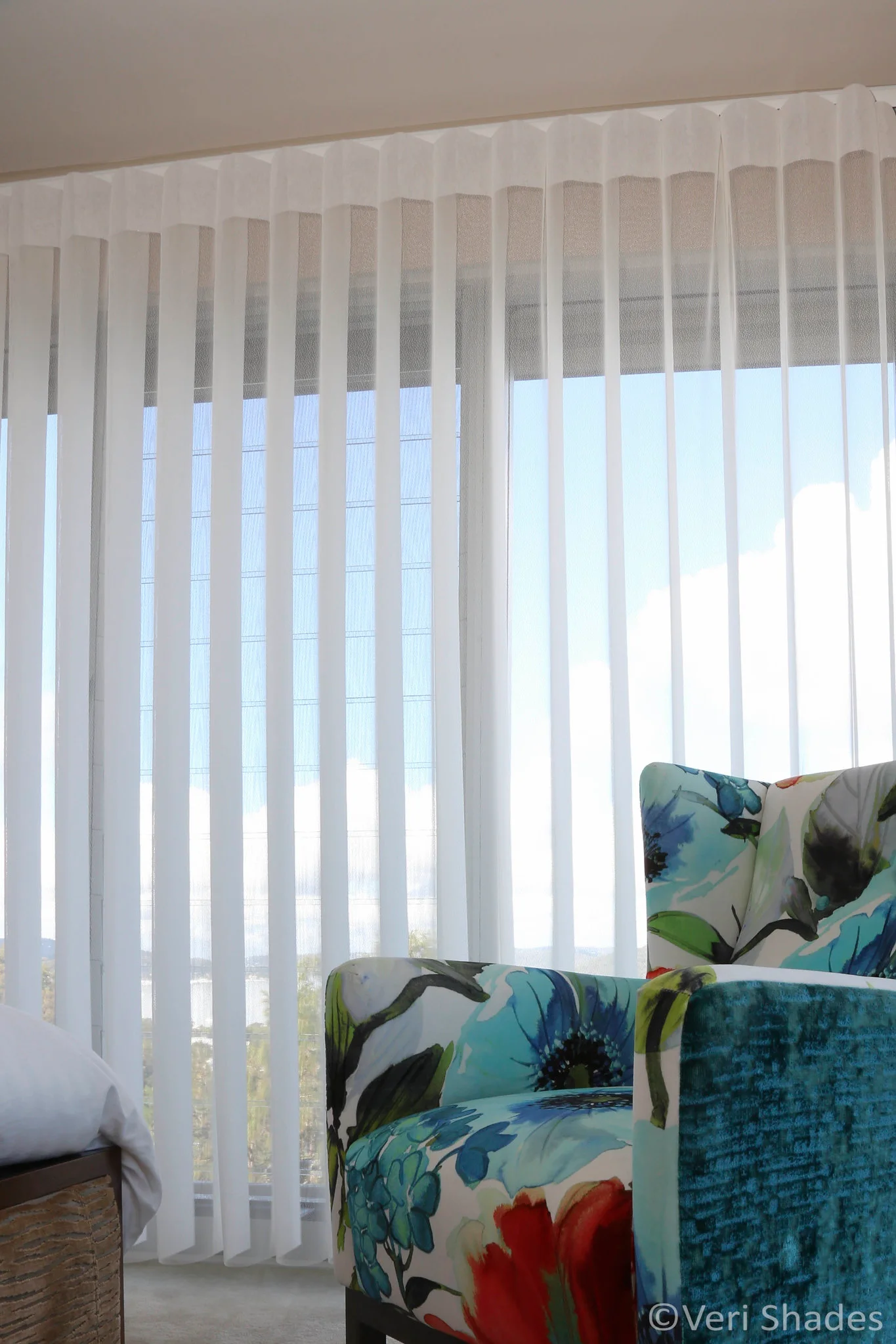 Veri Shades beside a floral armchair