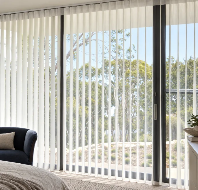 Veri Shades filtering a garden view beside a dark armchair