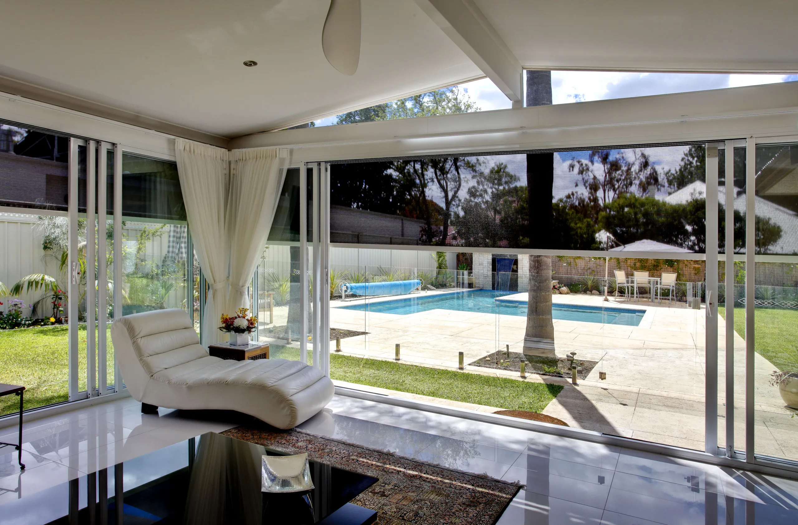 ZipScreen outdoor blinds shading a balcony with an uninterrupted view